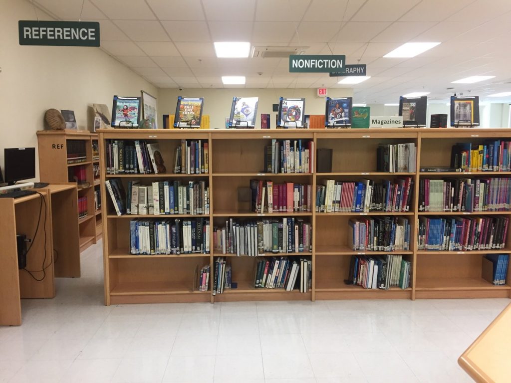 Tables, chairs, and bookshelves in the PCSST library