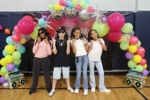 Four PCSST students posing at the 4–7 Talent Show